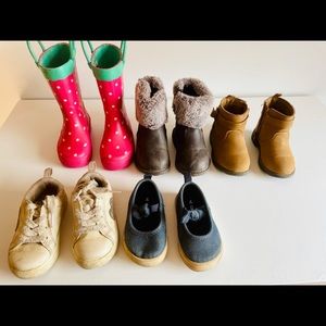 The 3 pairs of boots and the white sneakers are size 5. Blue pair is a size 4.